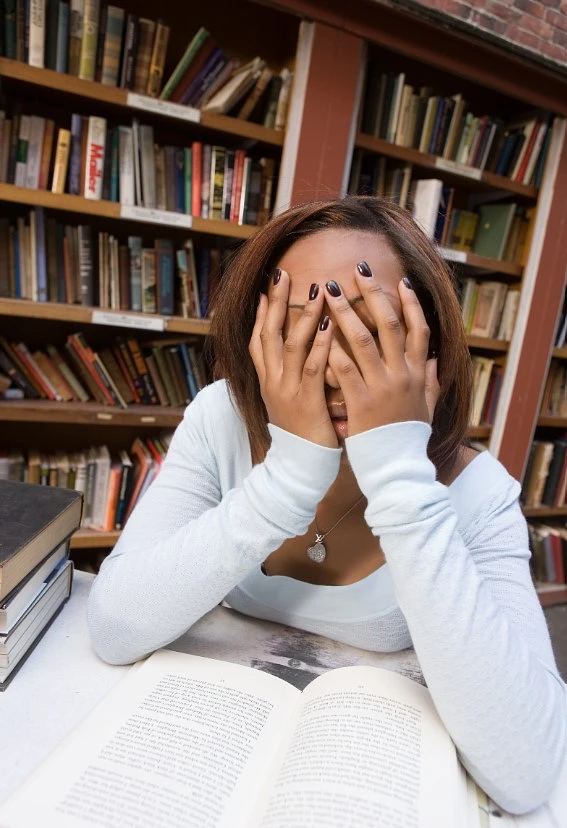 woman with head in hands