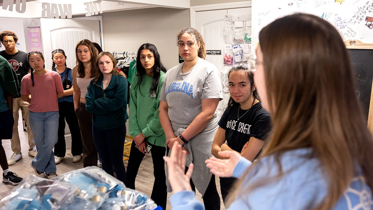 Students made 12 stops during their Alternative Spring Break trip in Charlotte. Pictured here at Queen City Harm Reduction, Sara Williams (third from right) said the “hands-on” work she and her fellow students performed was the highlight of the trip.